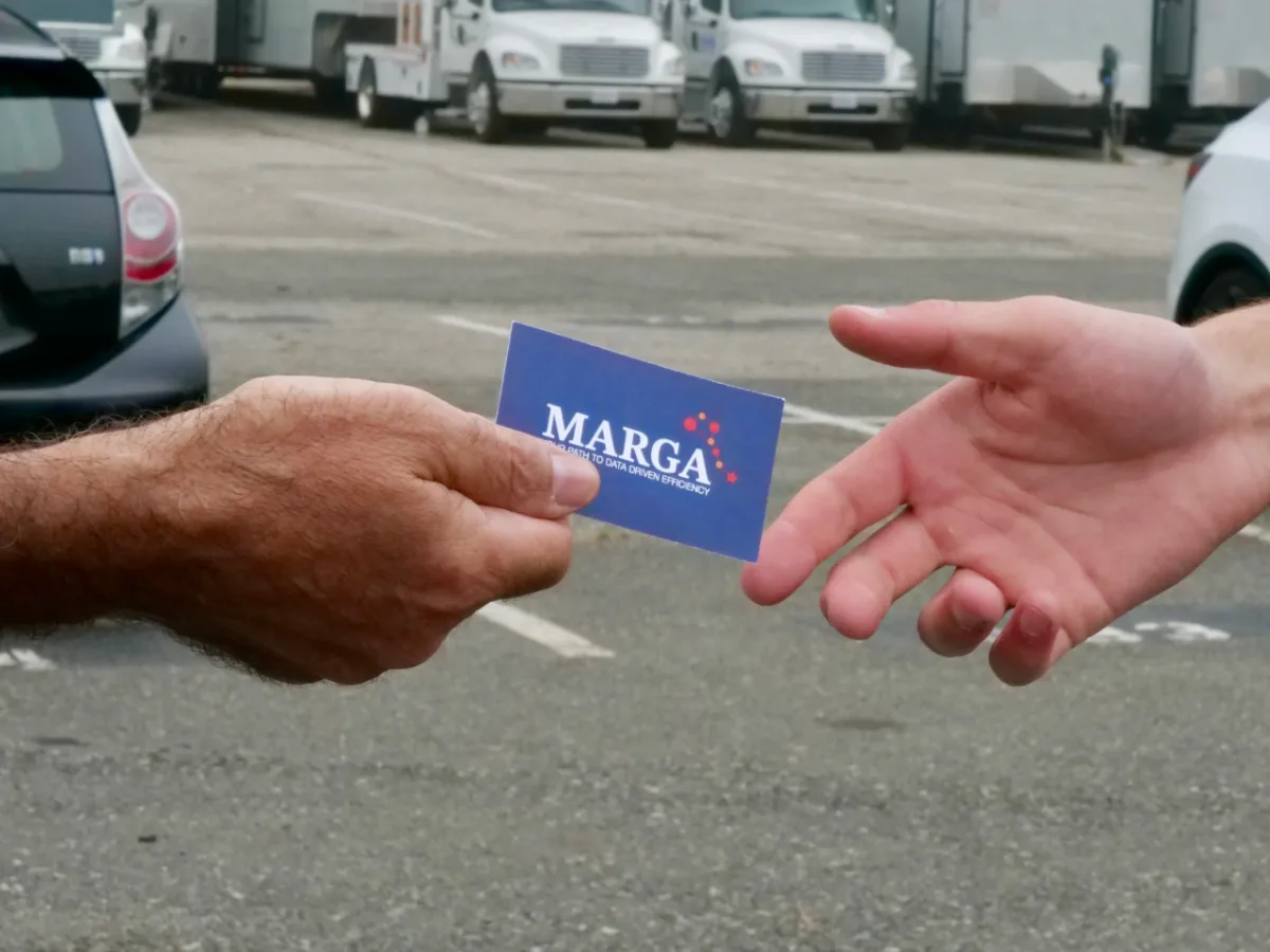 Marga representative handing a business card to a fleet manager